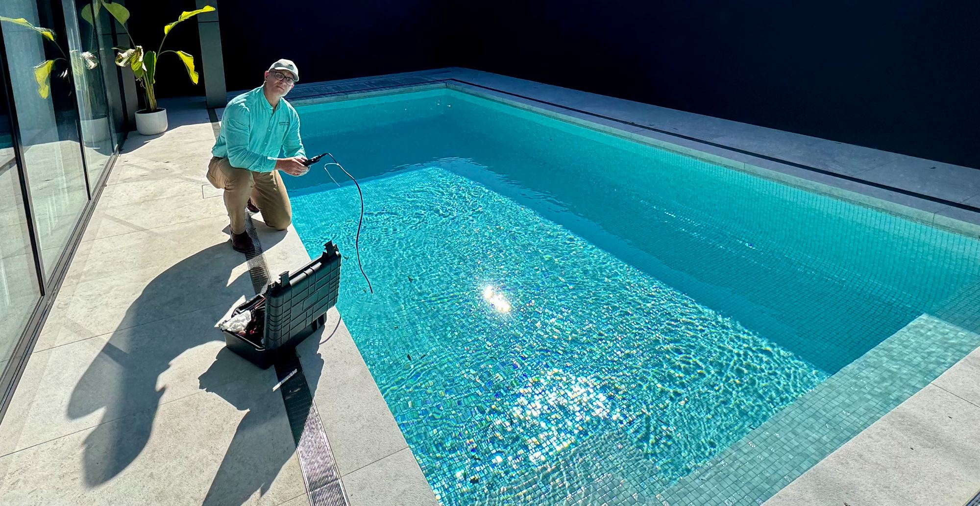 A Tectonic team member inspecting a finished pool